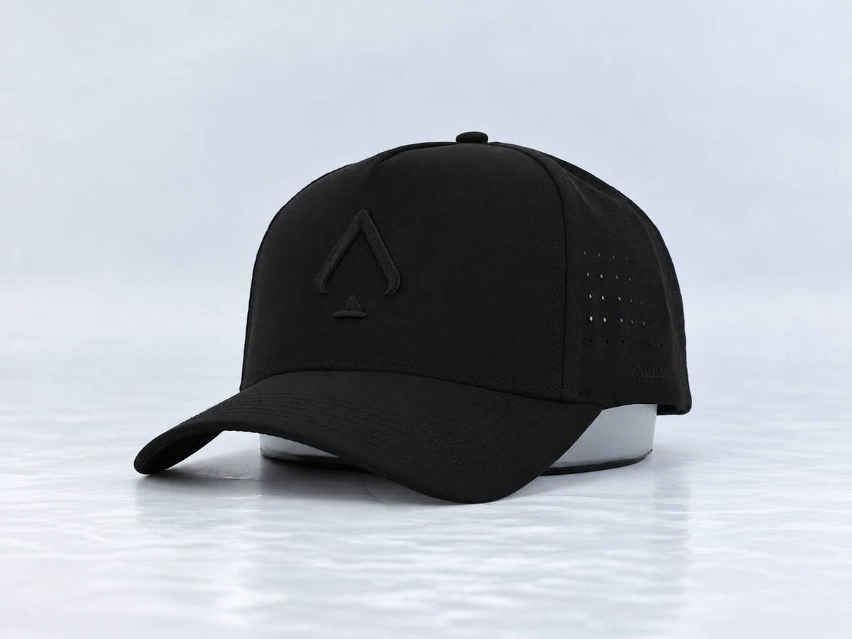 All In Lid Black Out hat, three-quarter front view, in black fabric with a tonal black logo.