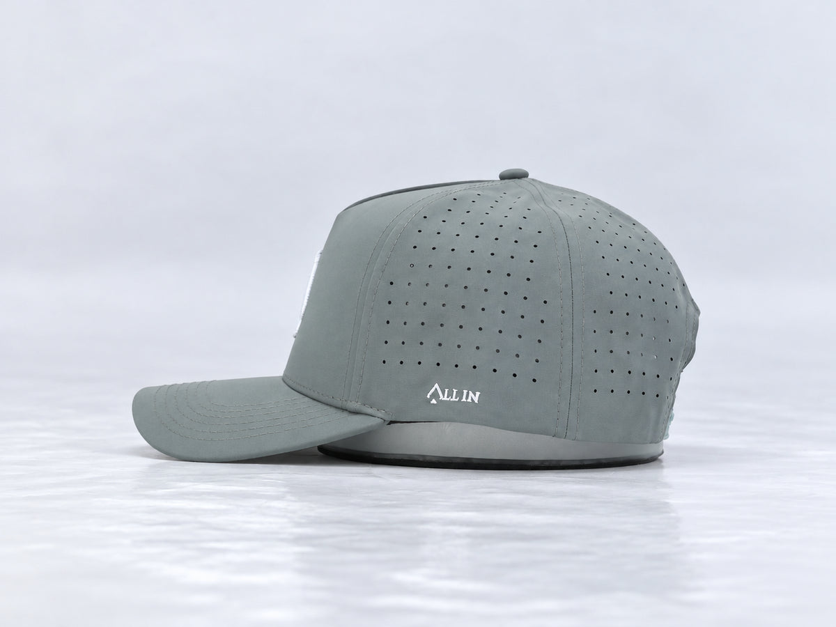 All In Lid Bloom Gray hat, side profile, in slate gray fabric with a white logo.