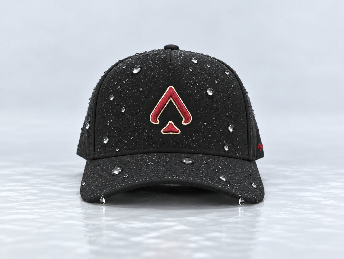 Front view of the All In Lid Black & Garnet hat with black fabric and a gold-edged garnet logo and water droplets on the crown and brim.