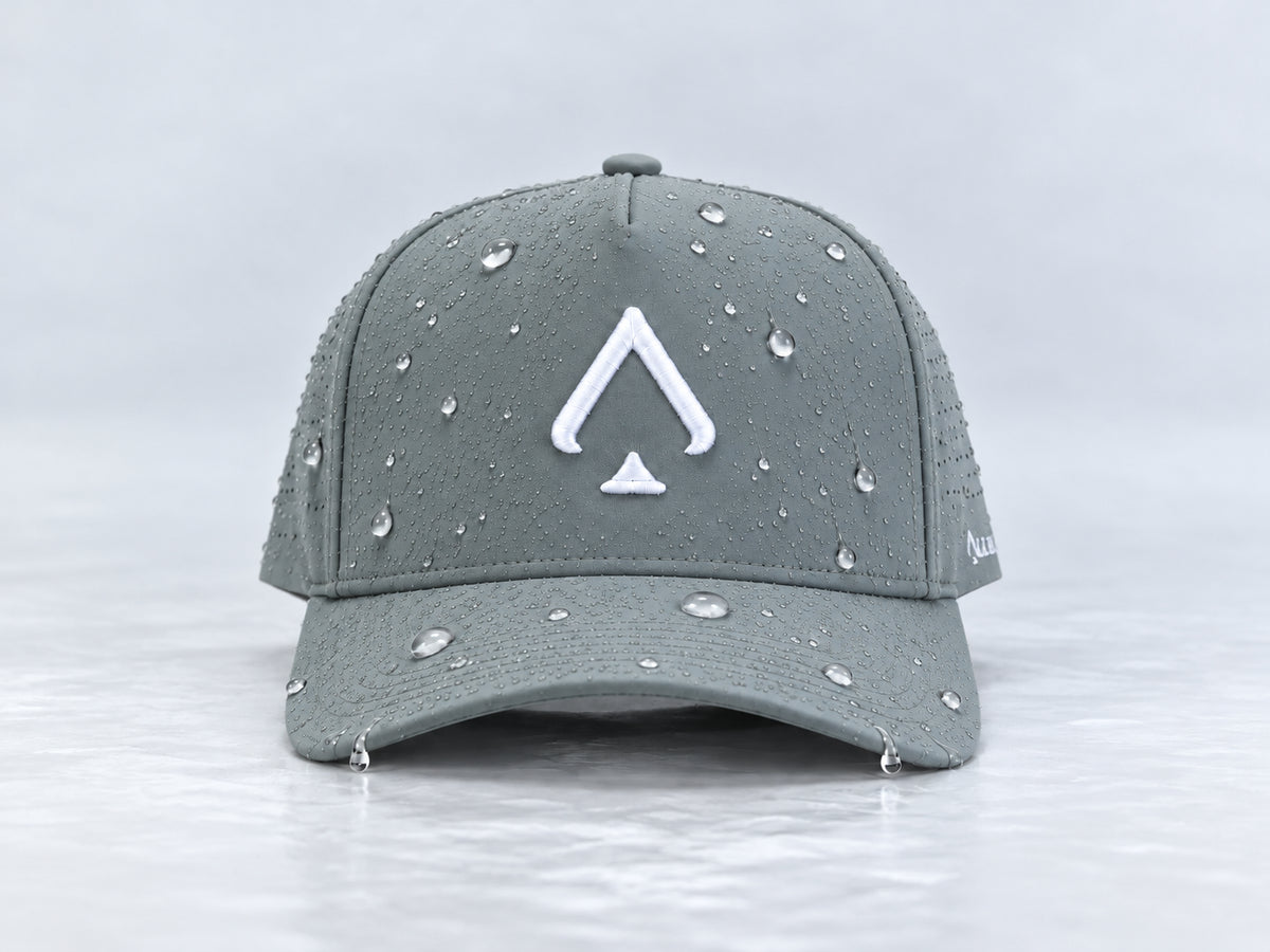 Front view of the All In Lid Bloom Gray hat with slate-gray fabric and a white logo and water droplets on the crown and brim.