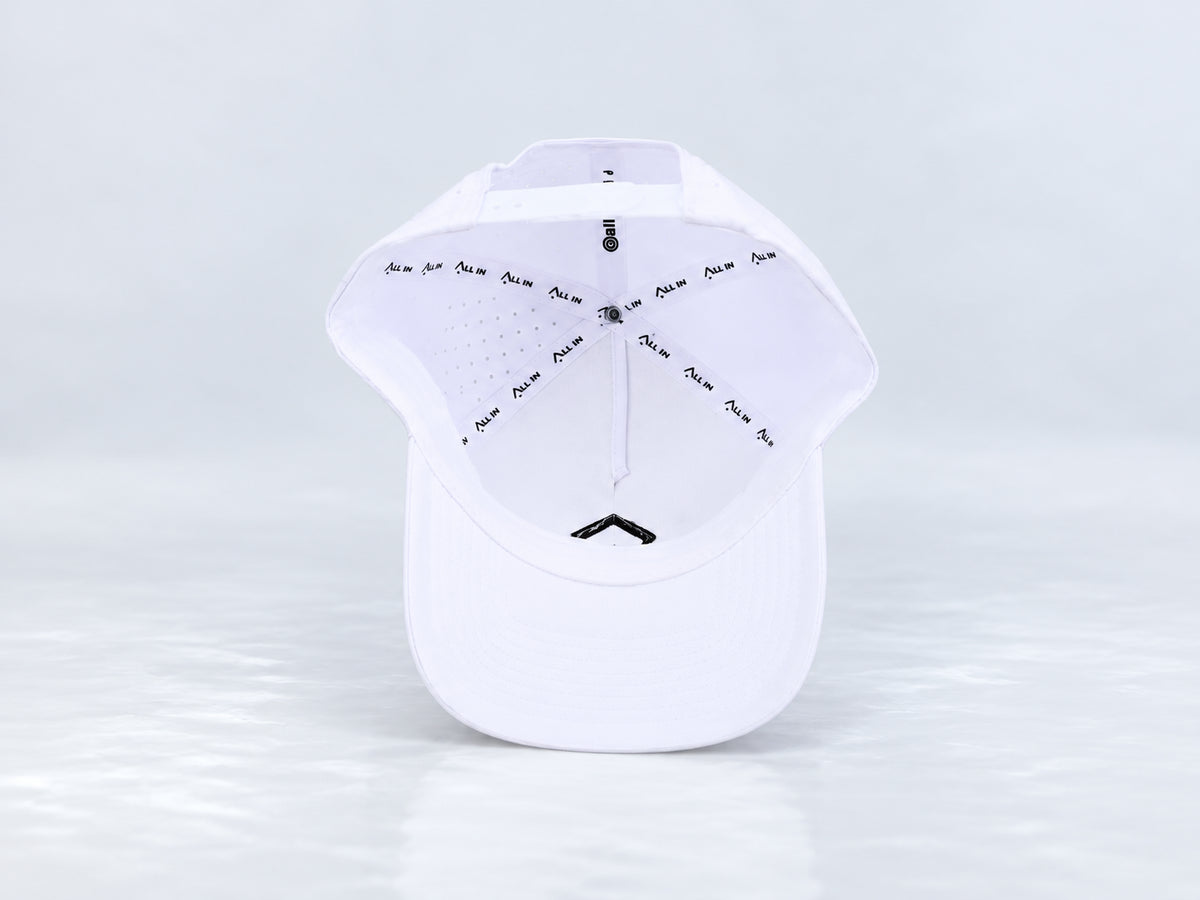 All In Lid OG Reversed white cap, interior view showing branded seam tape, the sweatband, mesh-backed front panel, and underside of the brim against a pale gray background.