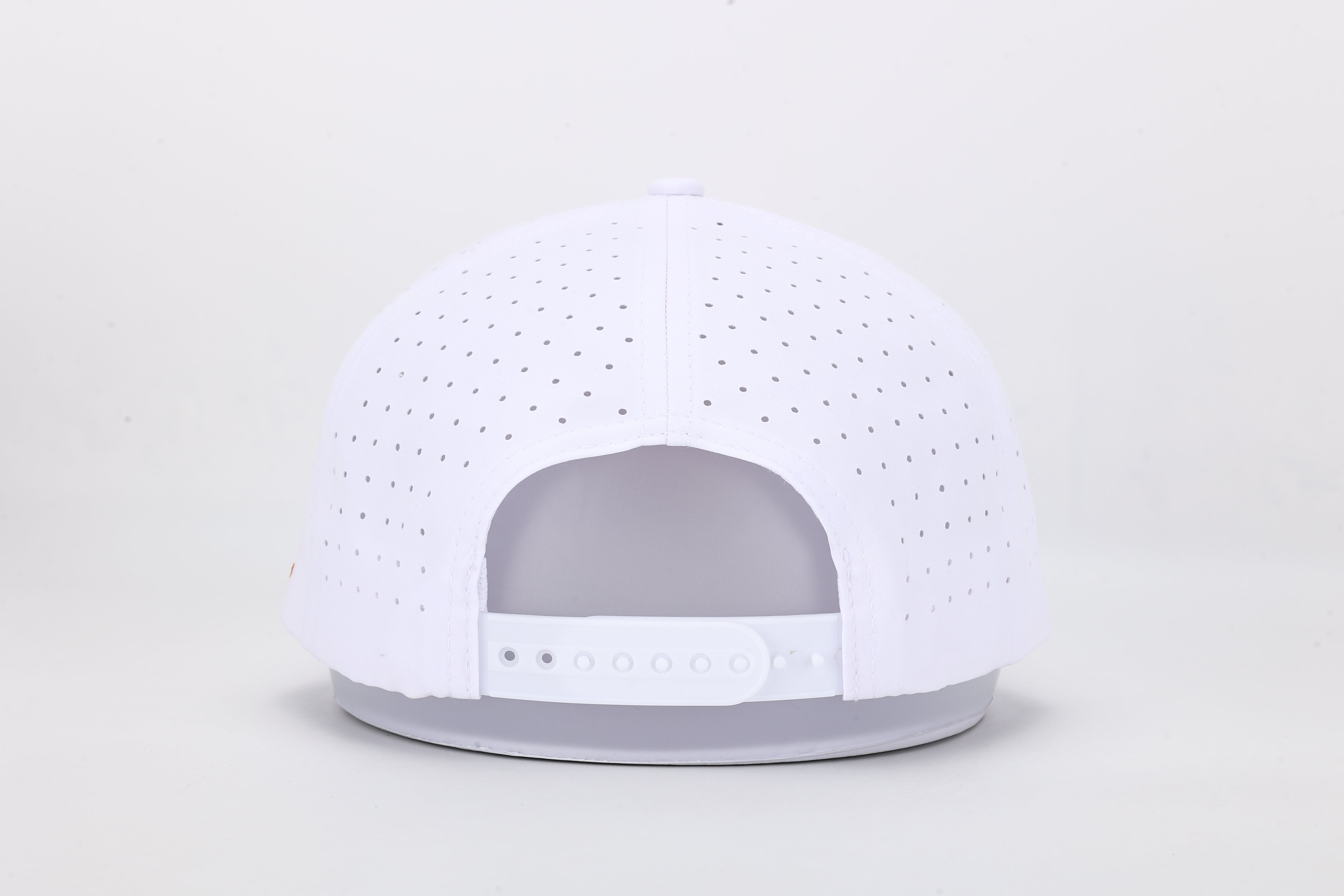 All In Wears Creamsicle cap, a white performance hat with an embroidered orange spade logo for a vibrant, summer look.