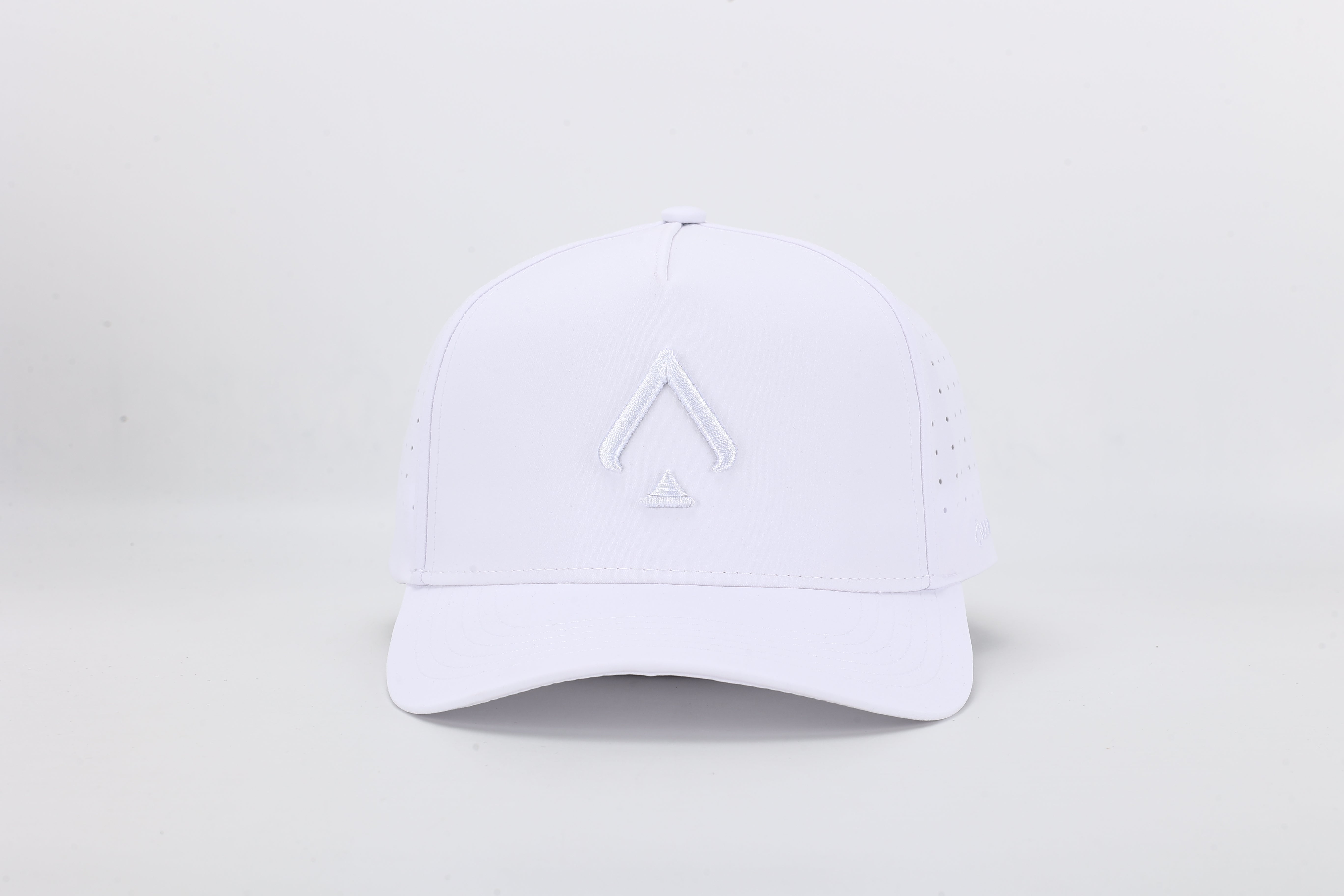 All In Wears White Out high-performance cap featuring the iconic white spade logo and laser-cut ventilation holes.