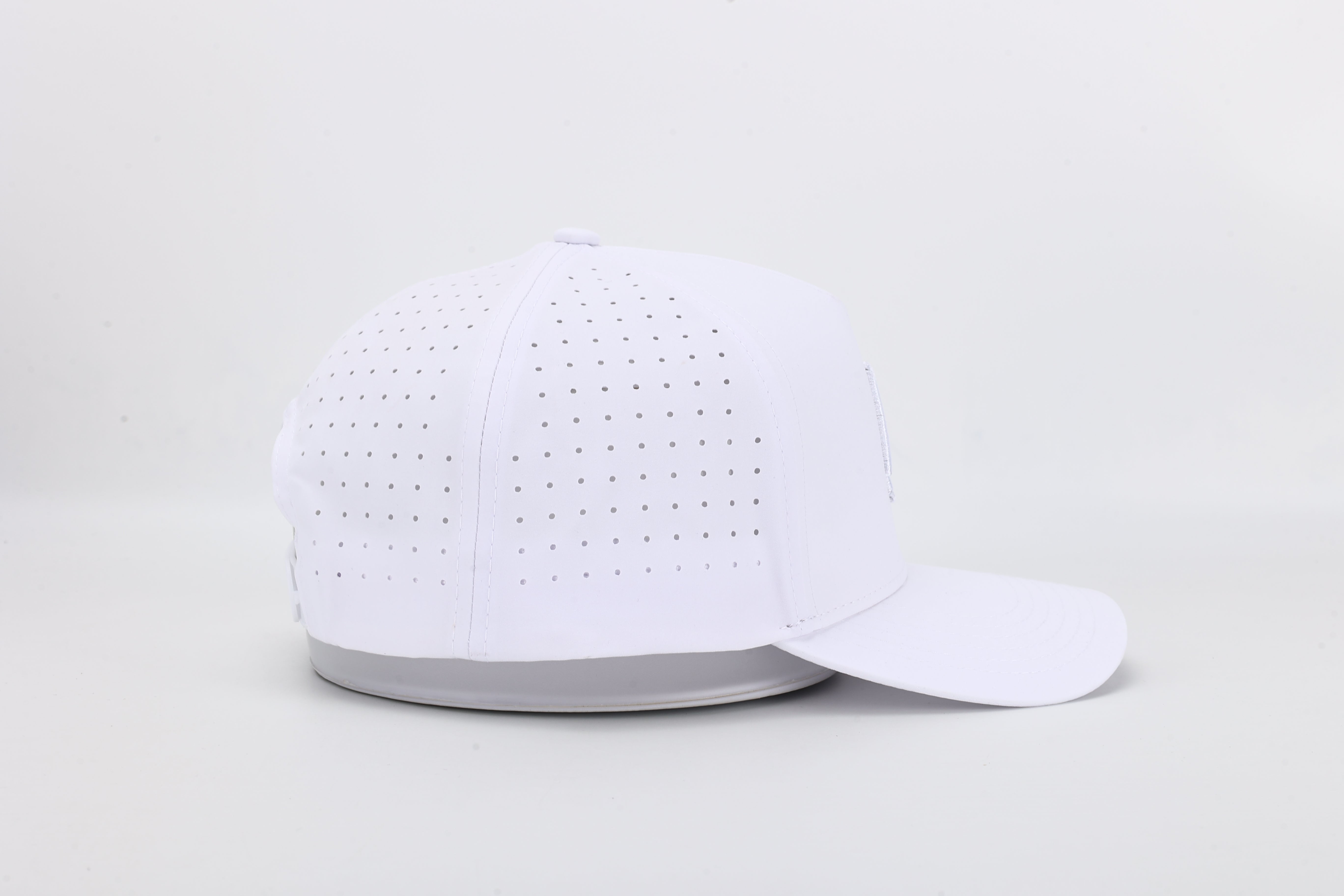 All In Wears White Out high-performance cap featuring the iconic white spade logo and laser-cut ventilation holes.