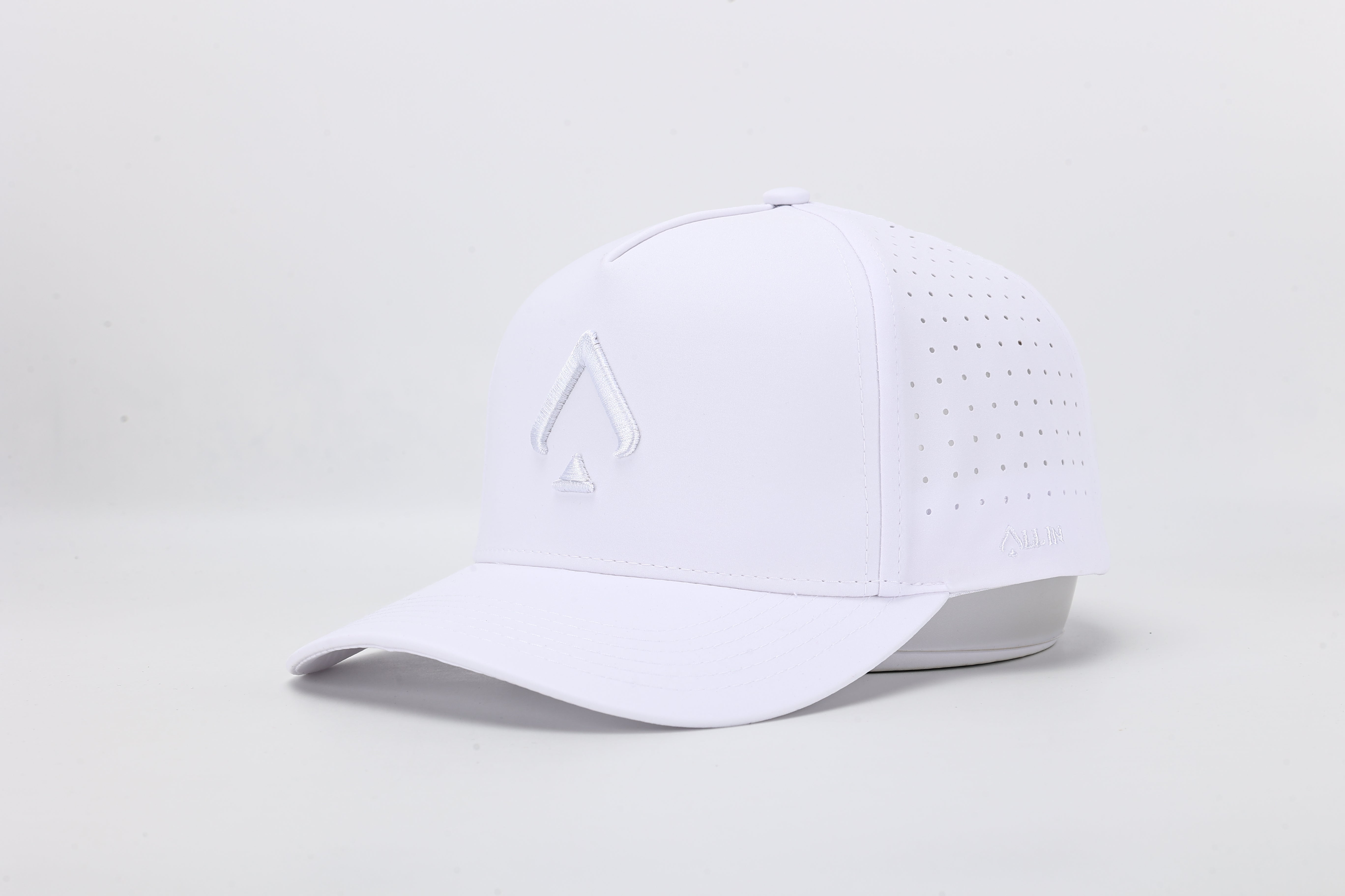 All In Wears White Out high-performance cap featuring the iconic white spade logo and laser-cut ventilation holes.
