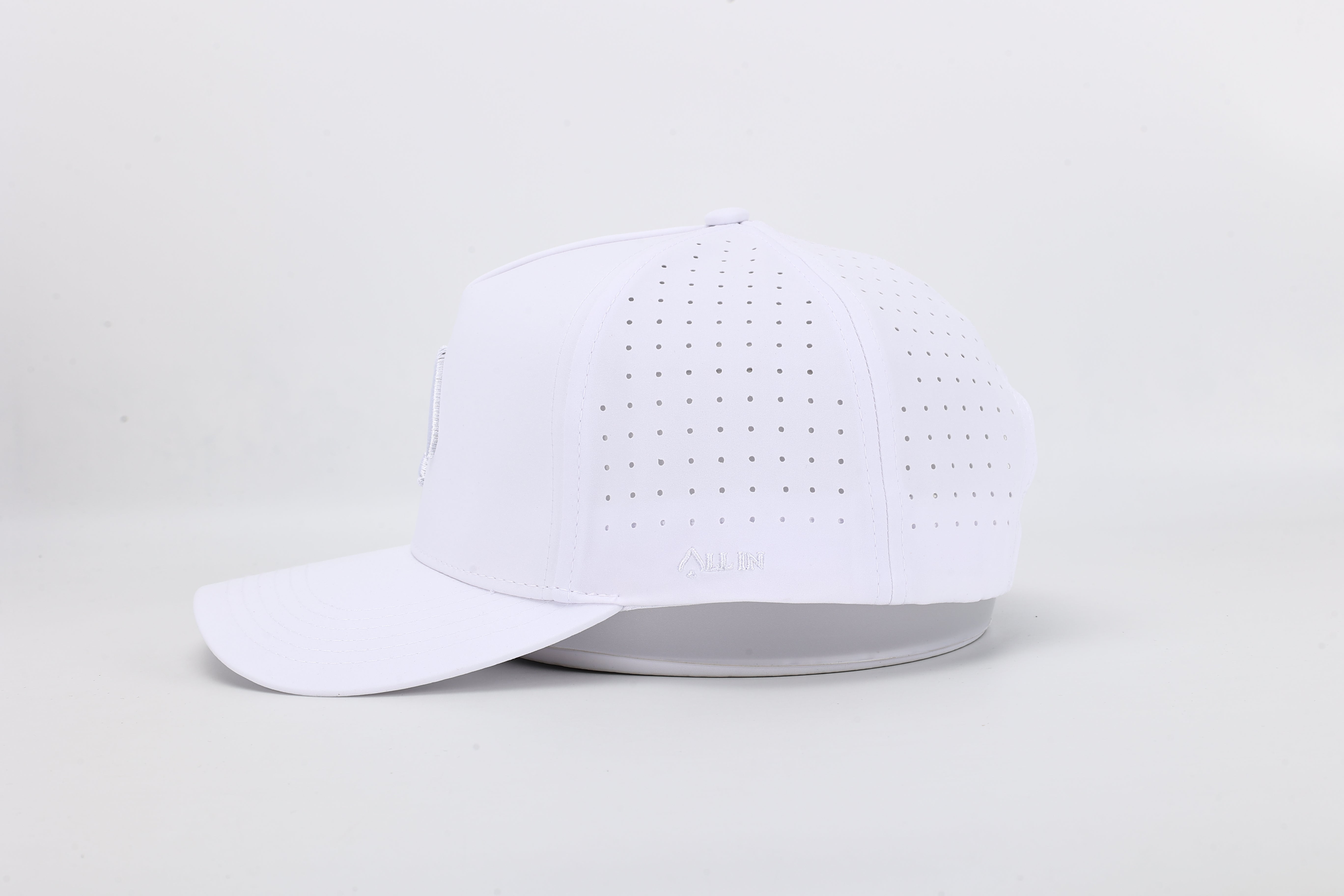 All In Wears White Out high-performance cap featuring the iconic white spade logo and laser-cut ventilation holes.