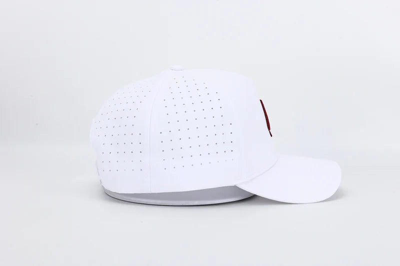 All In Wears Regal White performance cap, featuring a white body and an embroidered garnet and gold outline spade logo.