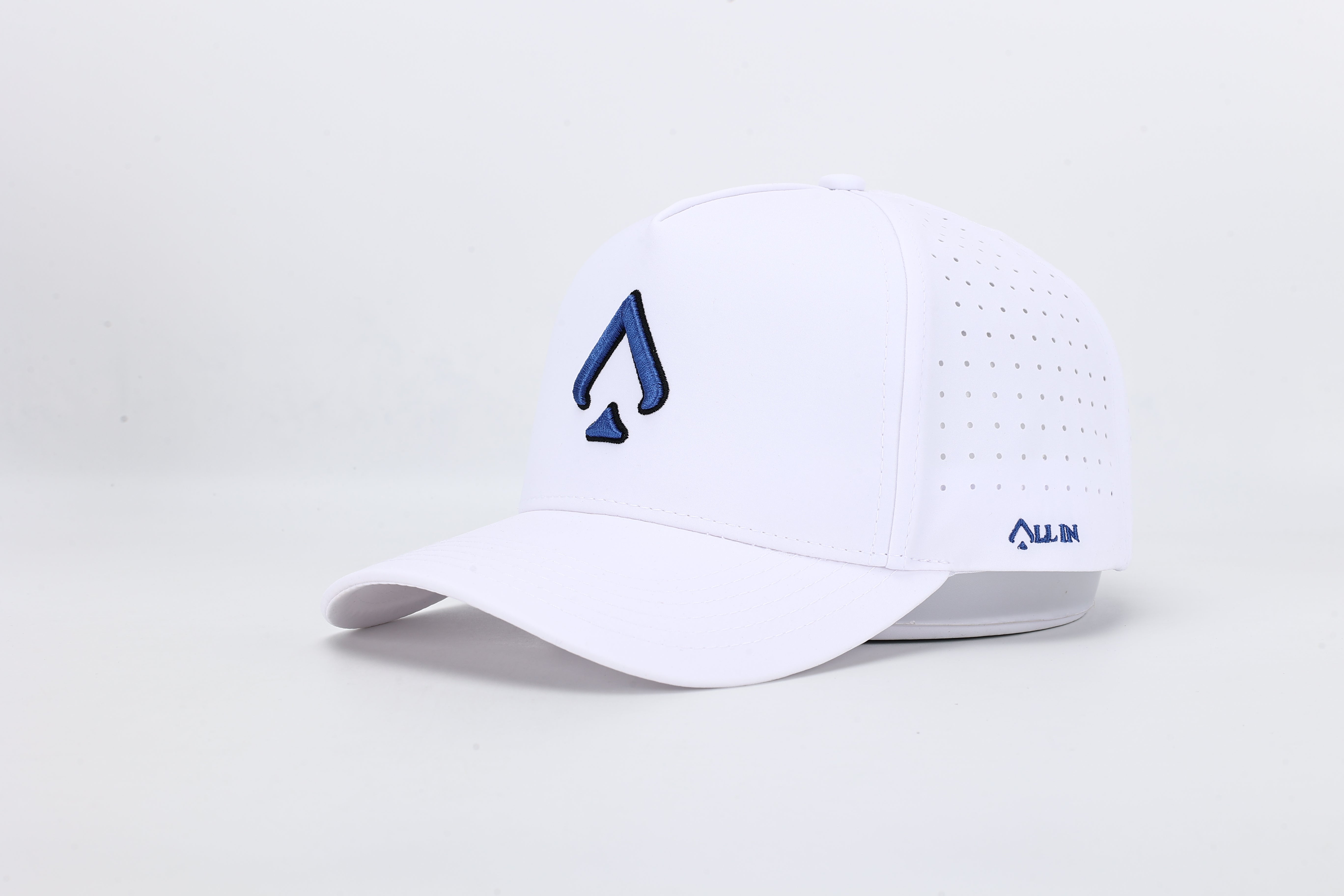 All In Wears Electric Blue cap in white performance fabric with contrasting electric blue embroidered spade logo.