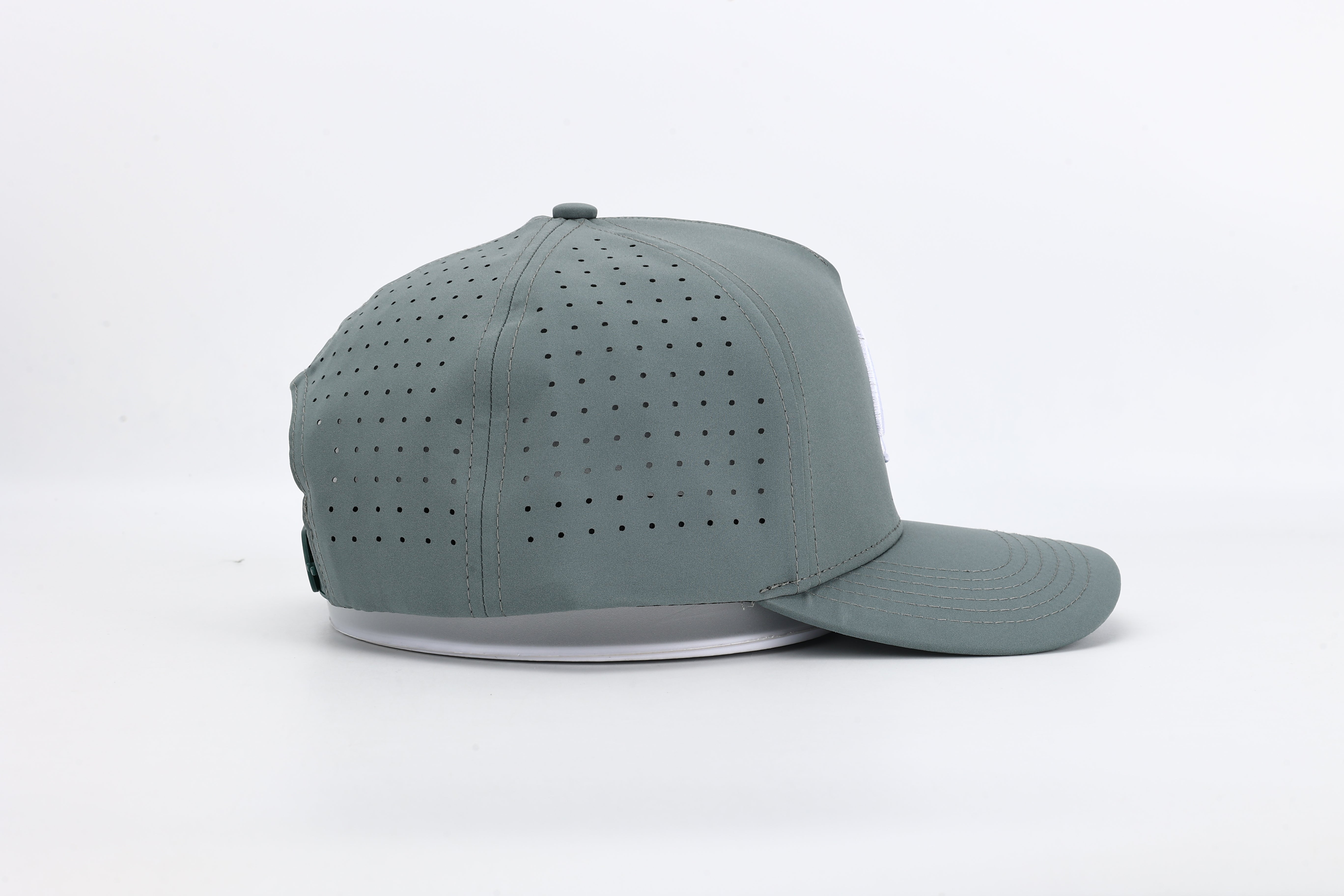 Bloom Gray performance cap featuring the All In logo with laser-cut ventilation holes for breathability and style.