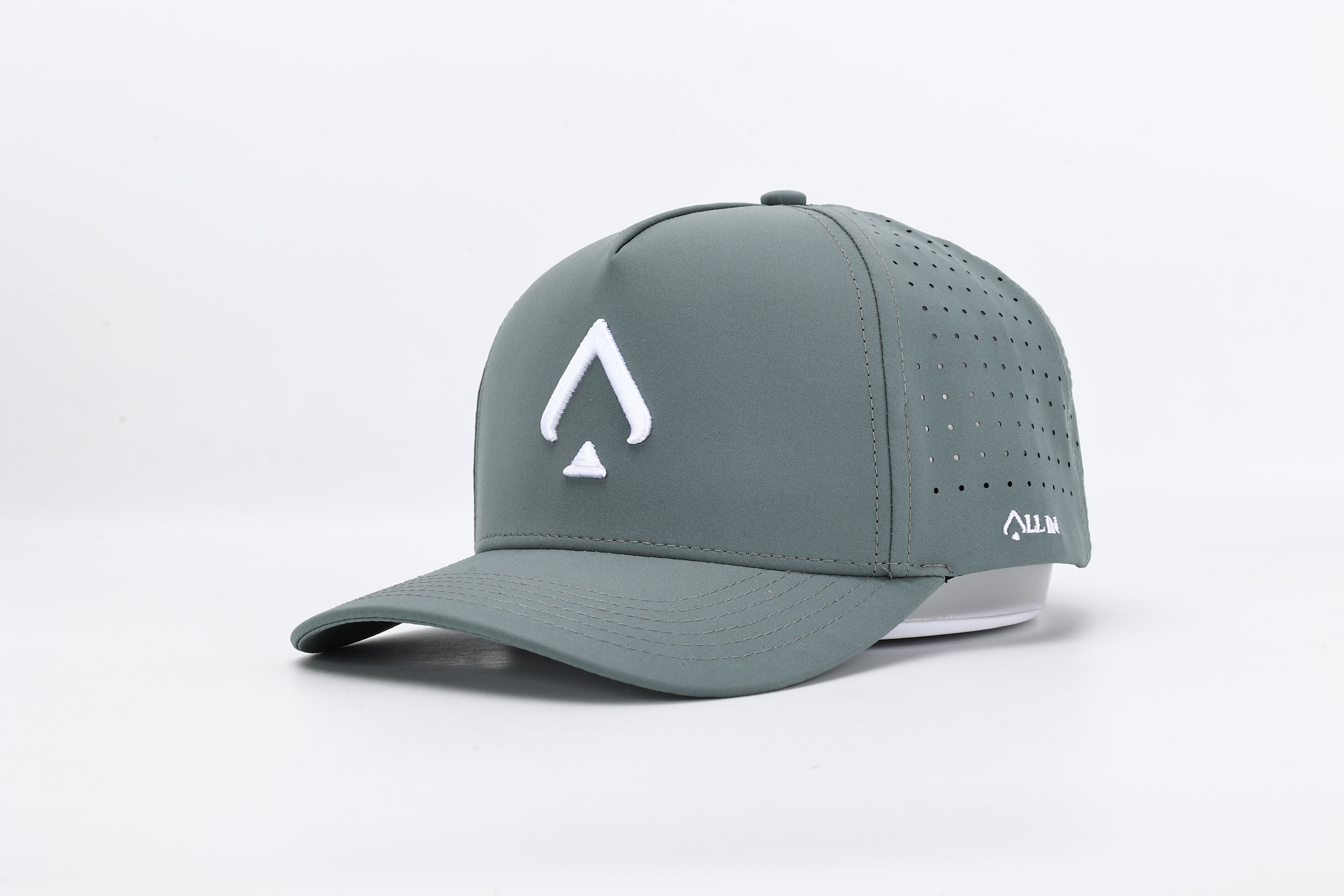 Bloom Gray performance cap featuring the All In logo with laser-cut ventilation holes for breathability and style.
