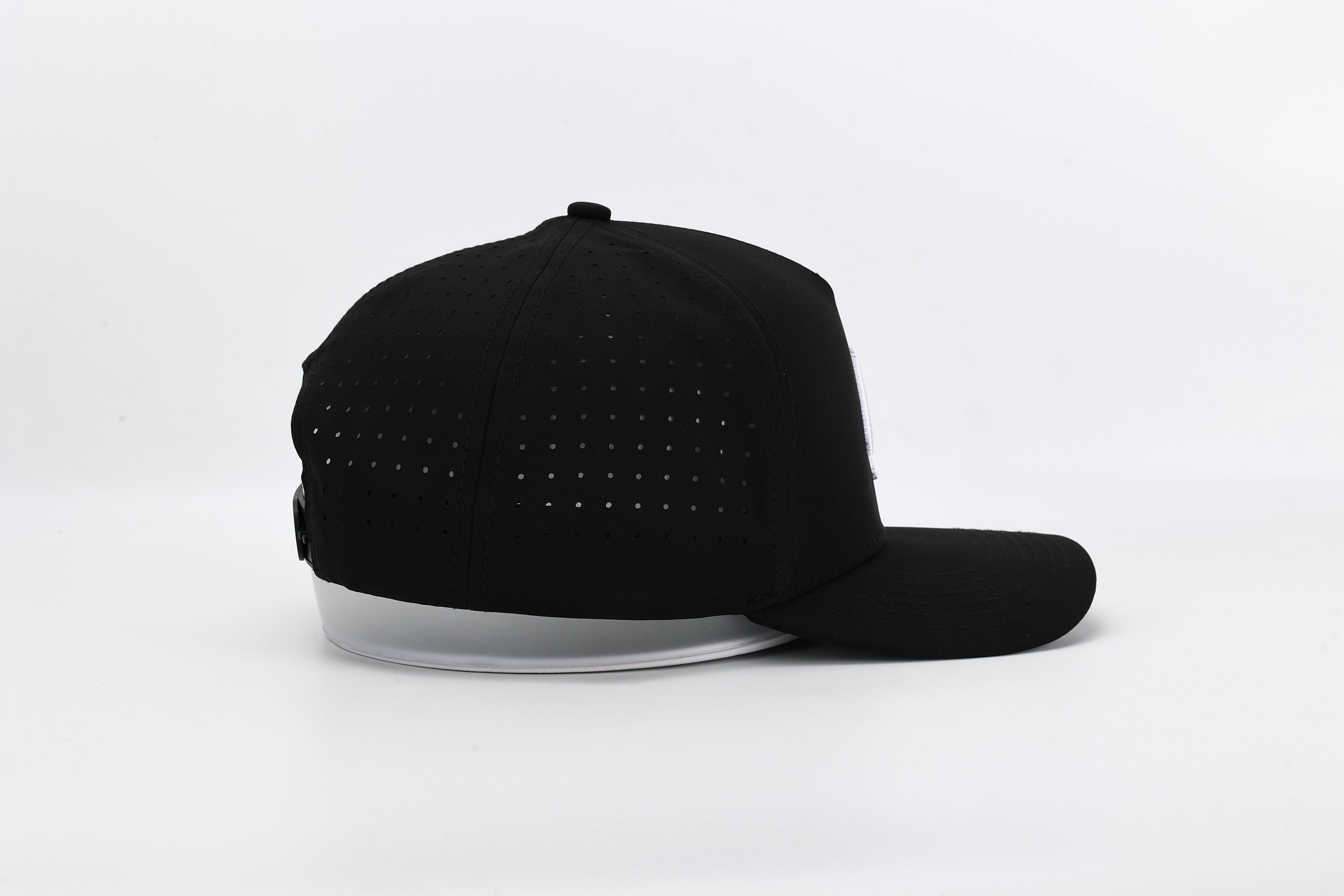 OG Black performance cap with All In logo and laser-perforated ventilation for ultimate breathability and bold style.