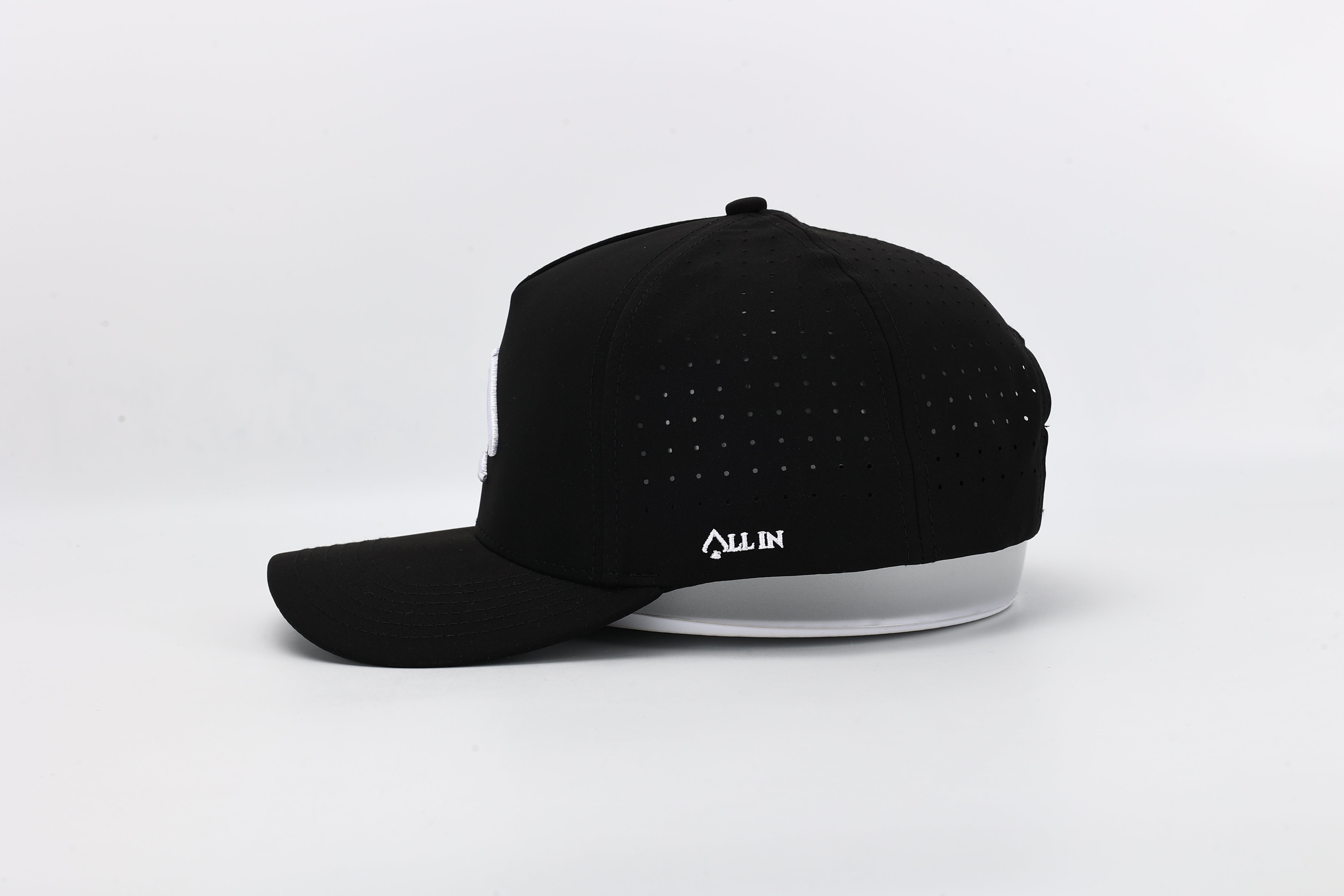 OG Black performance cap with All In logo and laser-perforated ventilation for ultimate breathability and bold style.