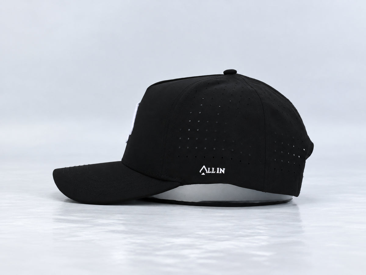 All In Lid OG hat, side profile, in black fabric with a white logo.