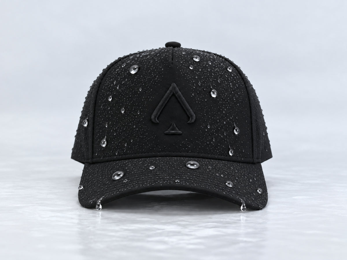 Front view of the All In Lid Black Out hat with black fabric and a tonal black logo and water droplets on the crown and brim.
