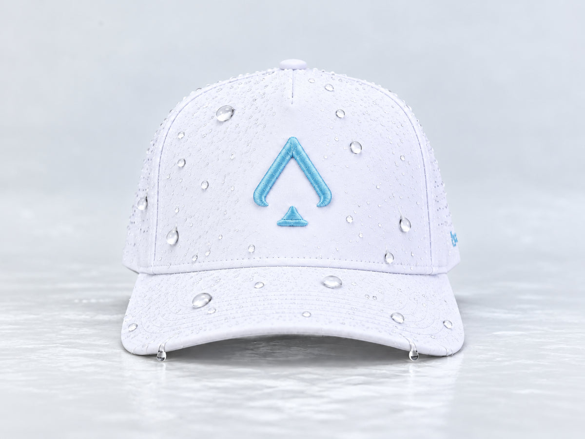 All In Lid Carolina Blue white cap with light blue spade embroidery and beaded water droplets on the crown and brim, straight-on front view against a pale gray background.