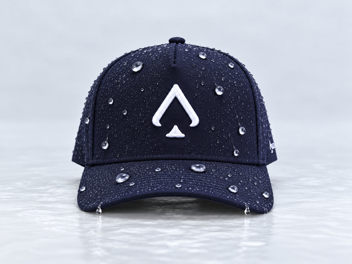 All In Lid Navy Seal navy cap with white spade embroidery and beaded water droplets on the crown and brim, straight-on front view against a pale gray background.