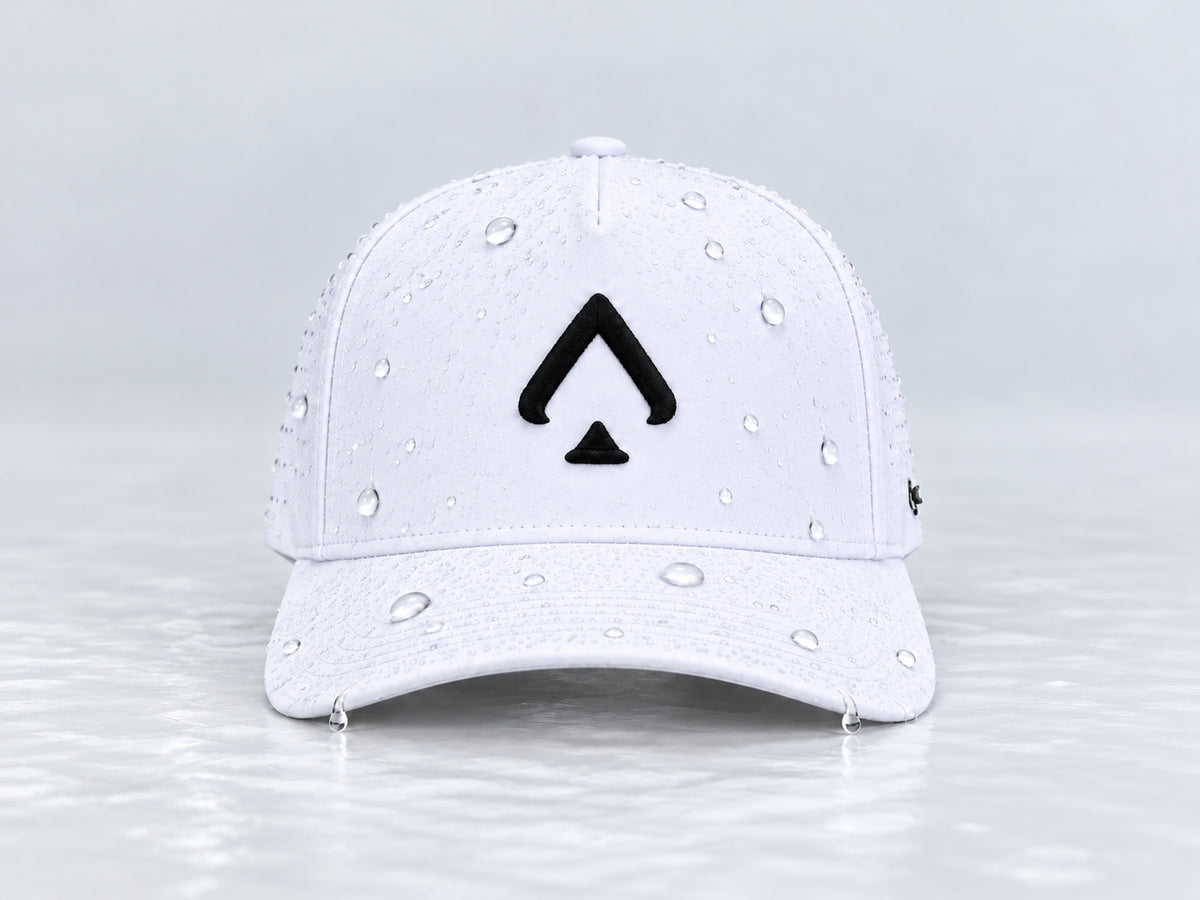 All In Lid OG Reversed white cap with black spade embroidery and beaded water droplets on the crown and brim, straight-on front view against a pale gray background.