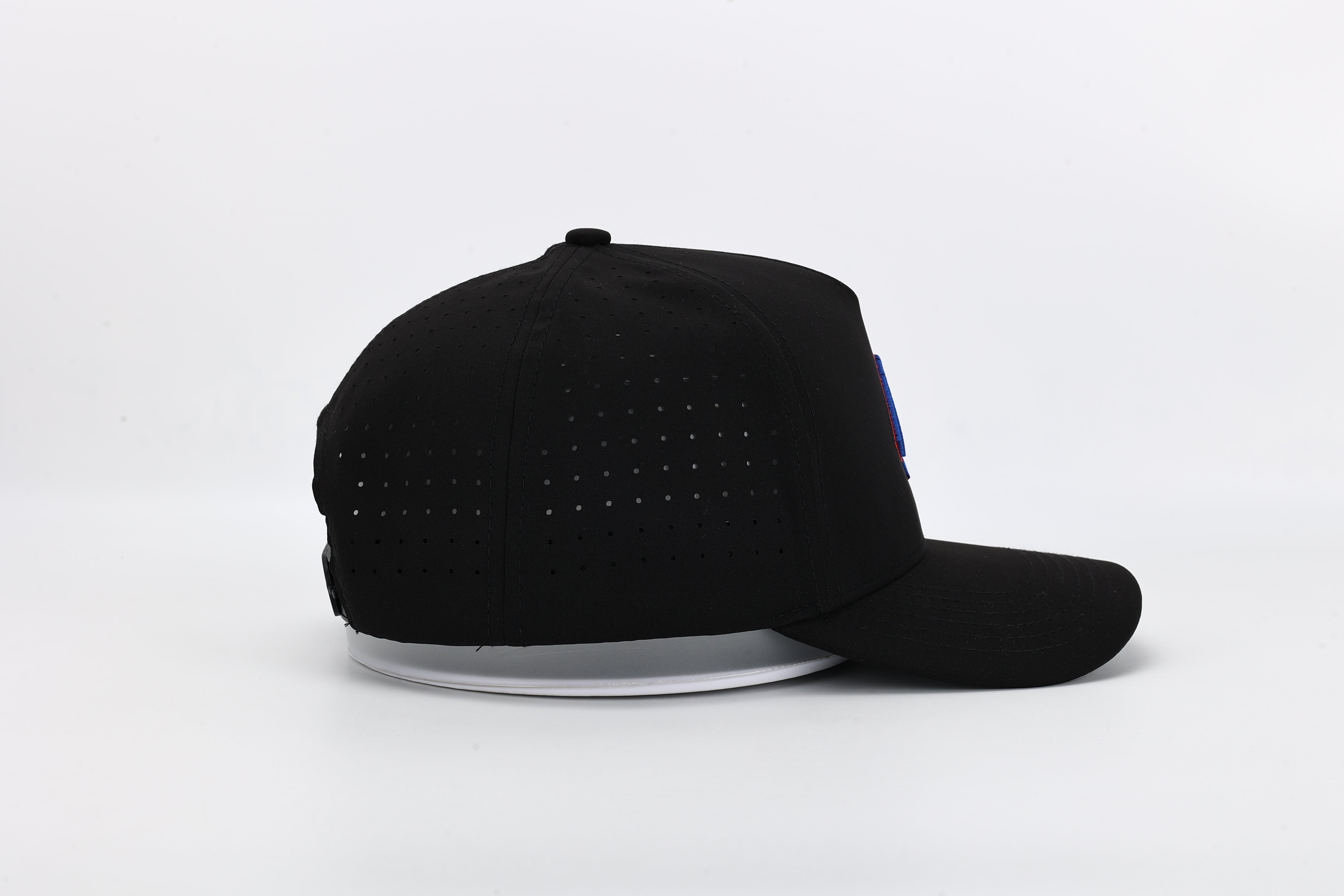All In Wears Black Out cap in all-black performance fabric with a debossed, matching black spade logo and laser-cut ventilation.