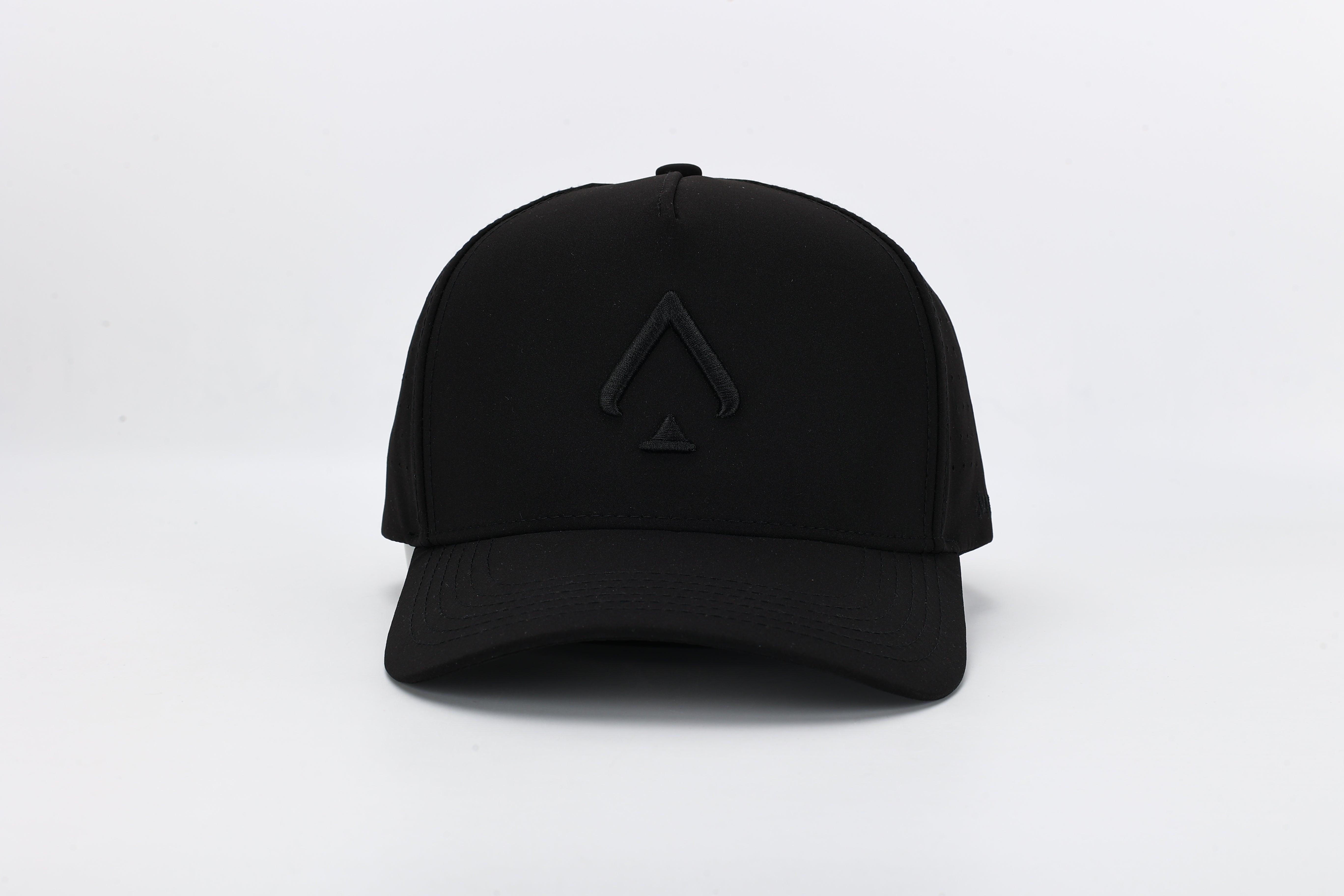 All In Wears Black Out cap in all-black performance fabric with a debossed, matching black spade logo and laser-cut ventilation