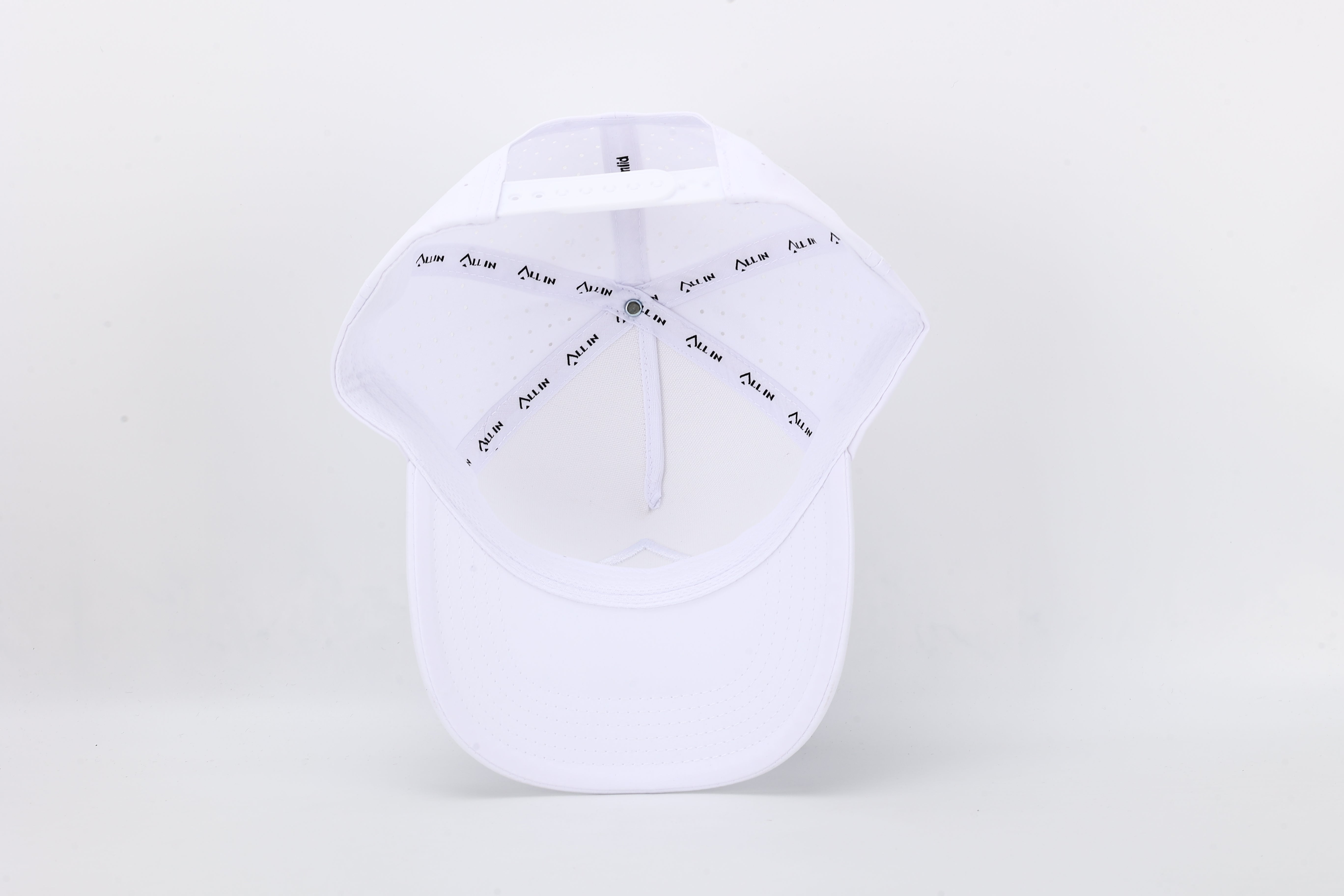 All In Wears White Out high-performance cap featuring the iconic white spade logo and laser-cut ventilation holes.