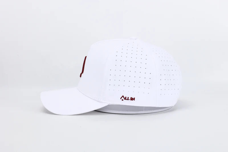 All In Wears Regal White performance cap, featuring a white body and an embroidered garnet and gold outline spade logo.