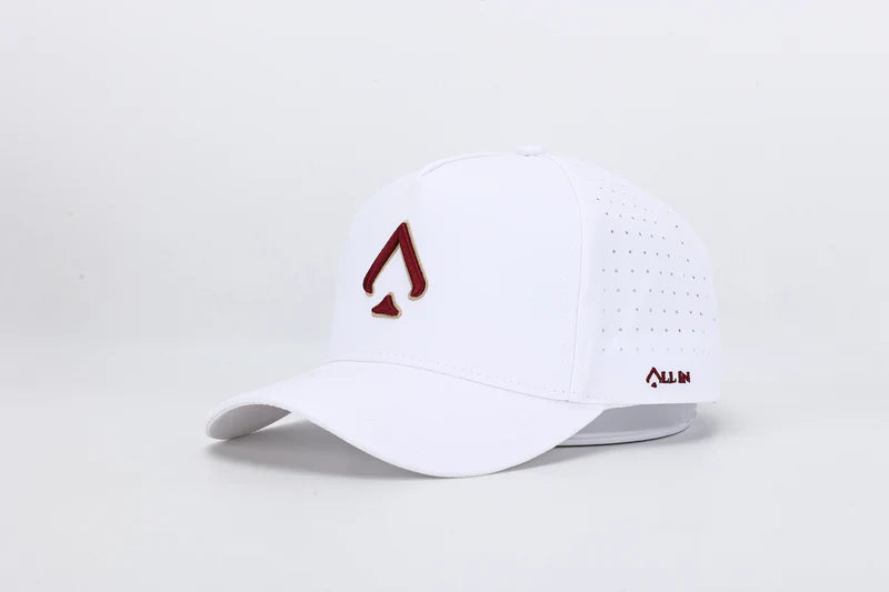 All In Wears Regal White performance cap, featuring a white body and an embroidered garnet and gold outline spade logo.