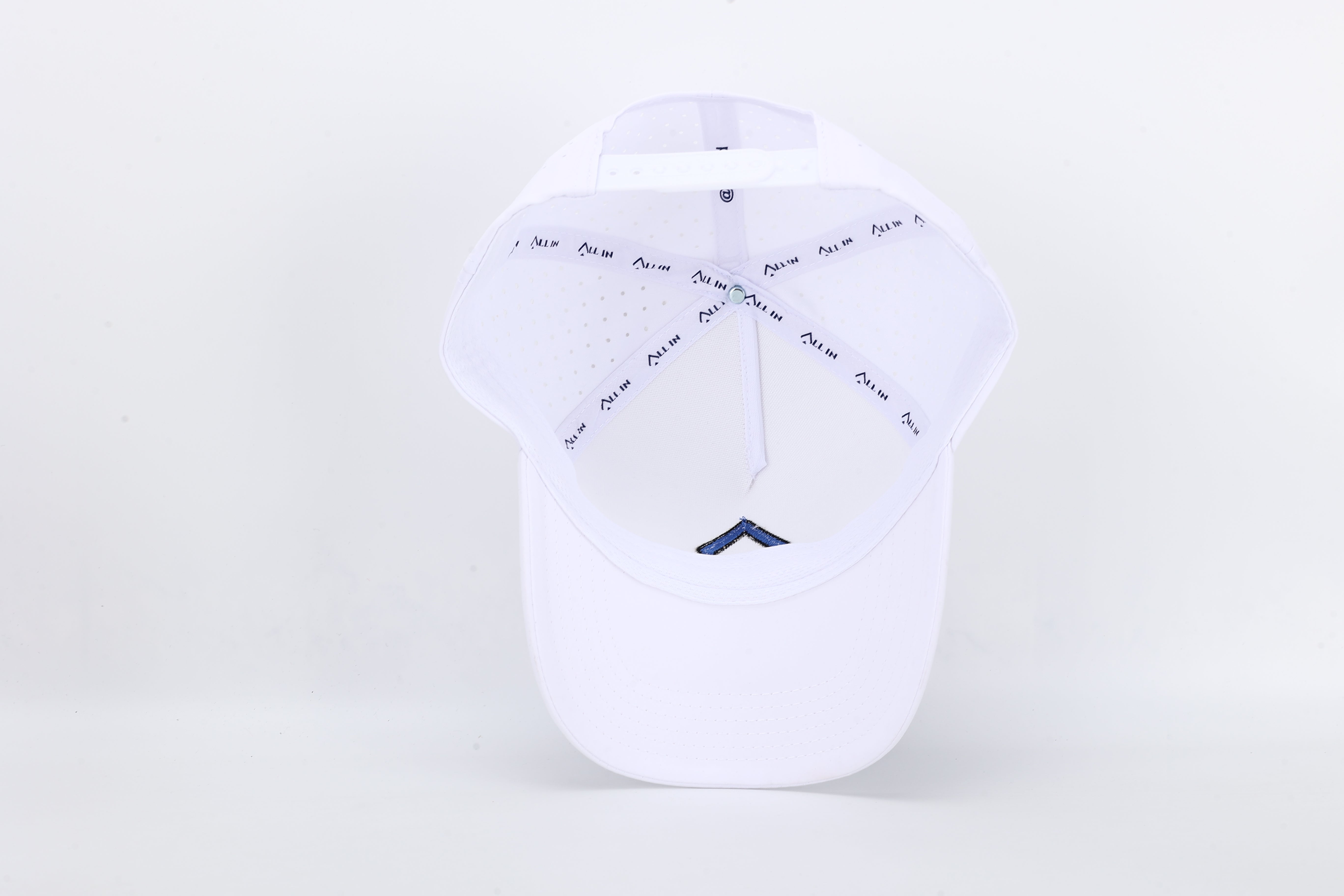 All In Wears Electric Blue cap in white performance fabric with contrasting electric blue embroidered spade logo.