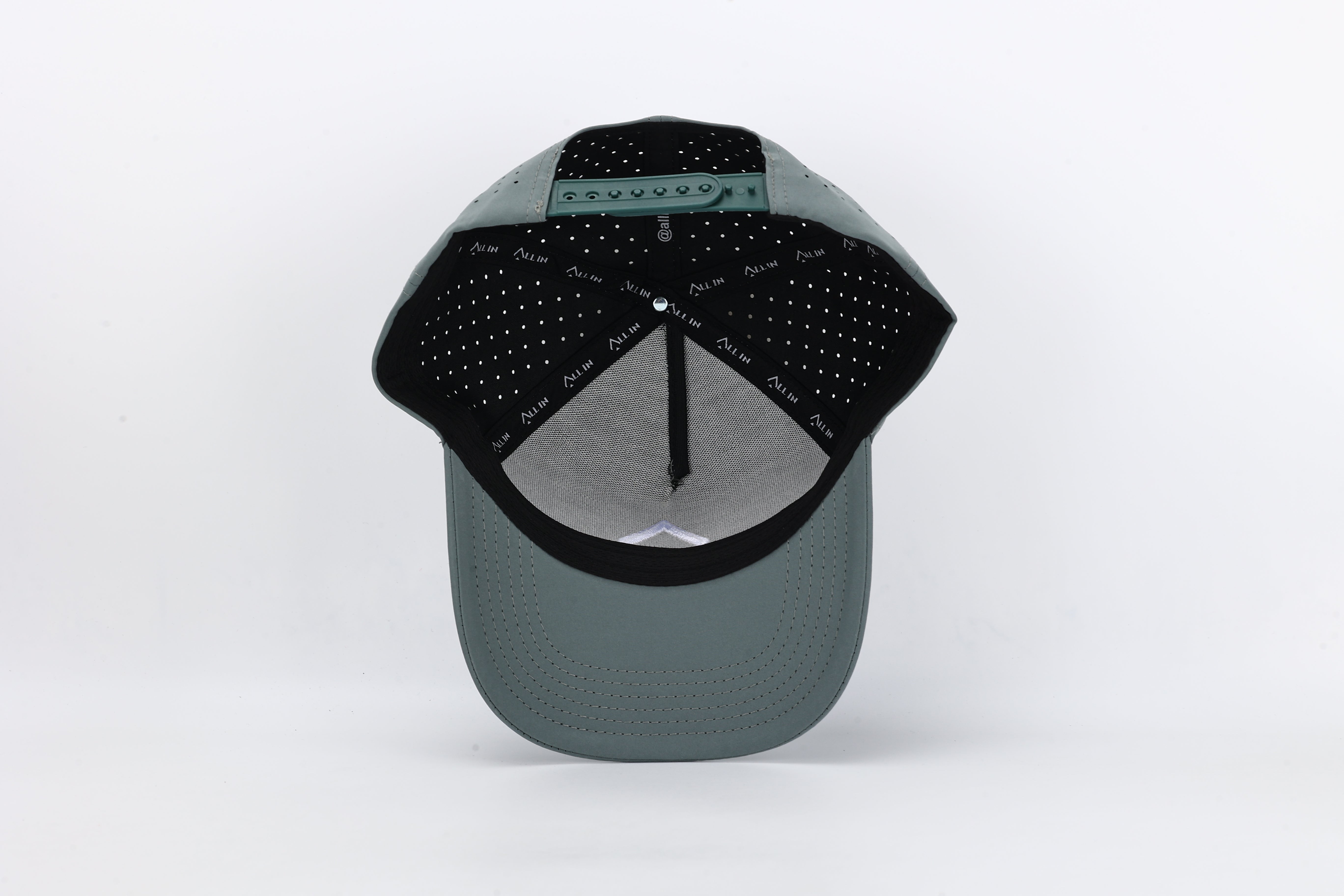 Bloom Gray performance cap featuring the All In logo with laser-cut ventilation holes for breathability and style.